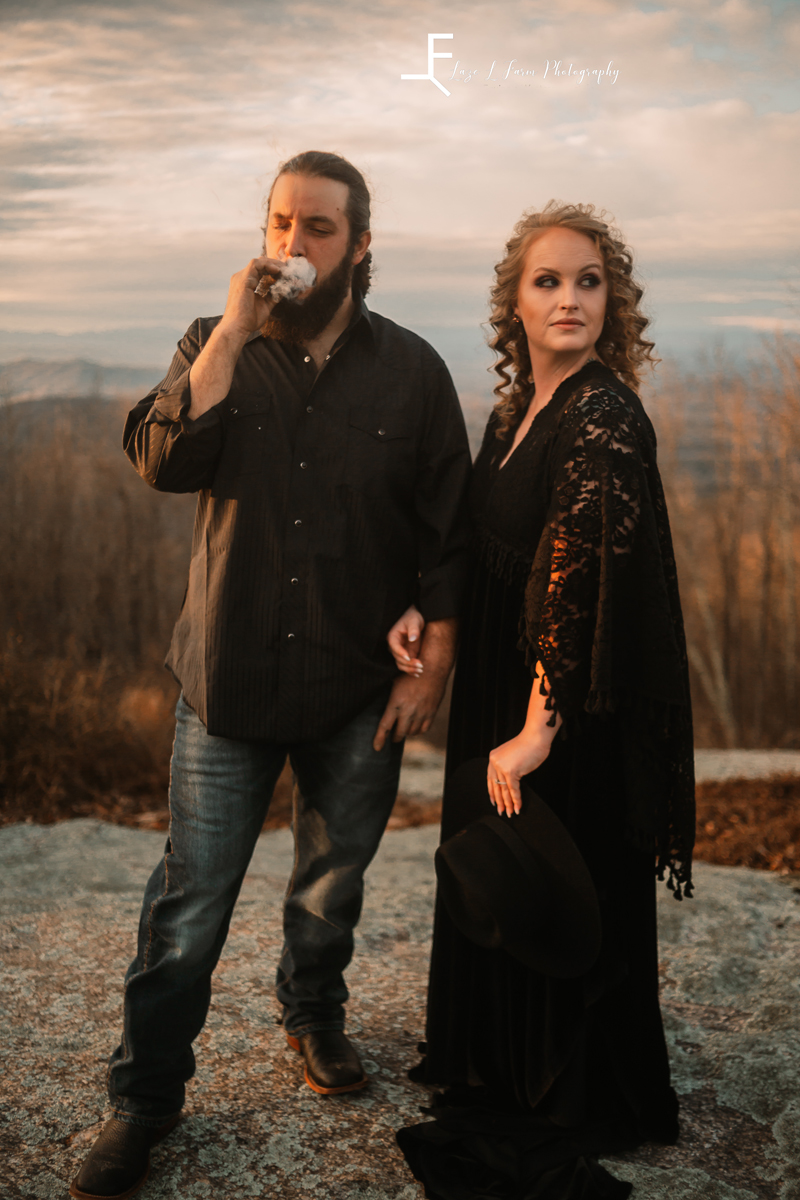 Laze L Farm Photography | Engagement  | Taylorsville NC | him smoking and her looking off into the distance