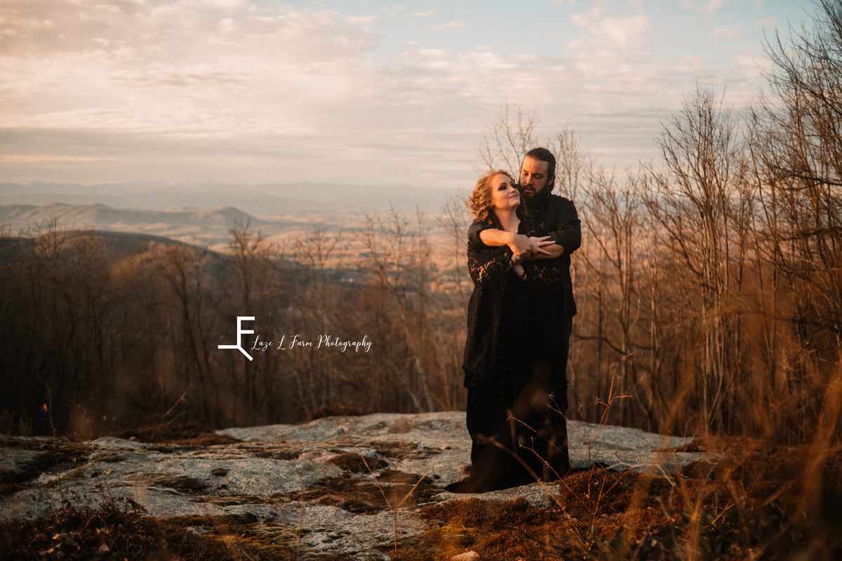 Laze L Farm Photography | Engagement  | Taylorsville NC | him holding her in his arms with the view in the background