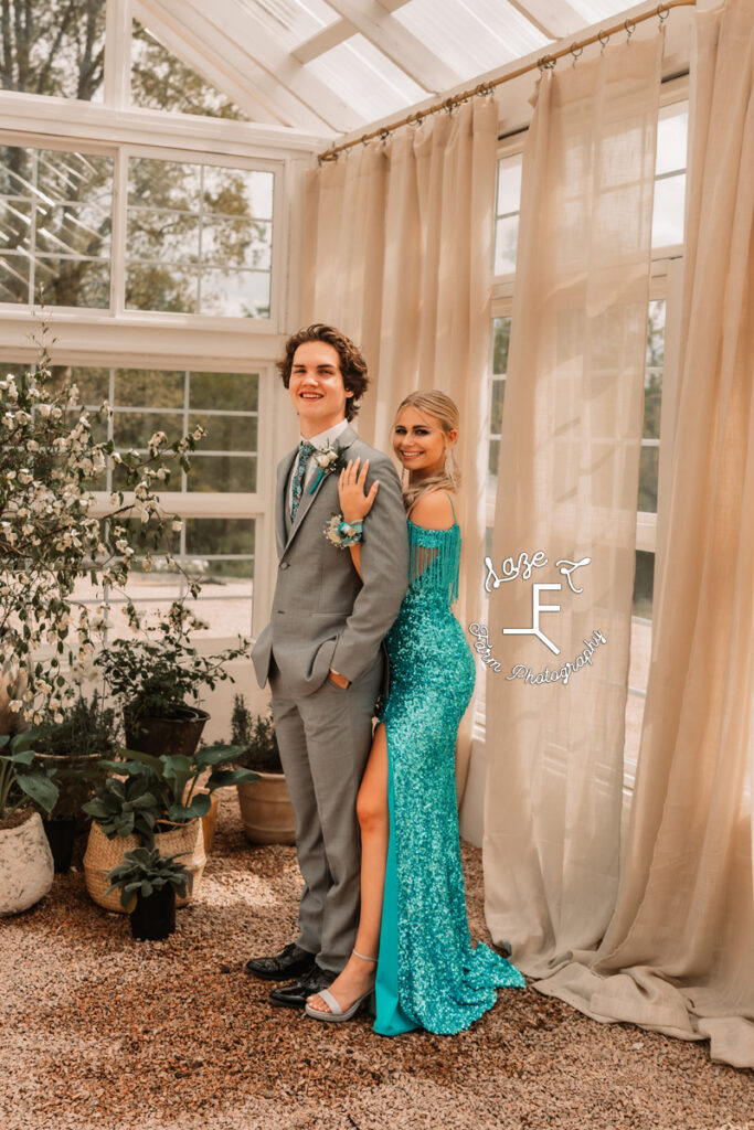 Reid standing behind Tanner holding his shoulder