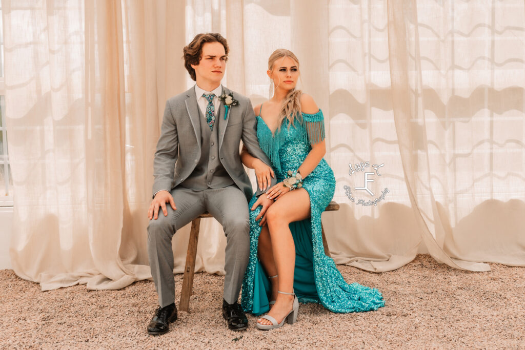 Tanner and Reid sitting on bench looking left