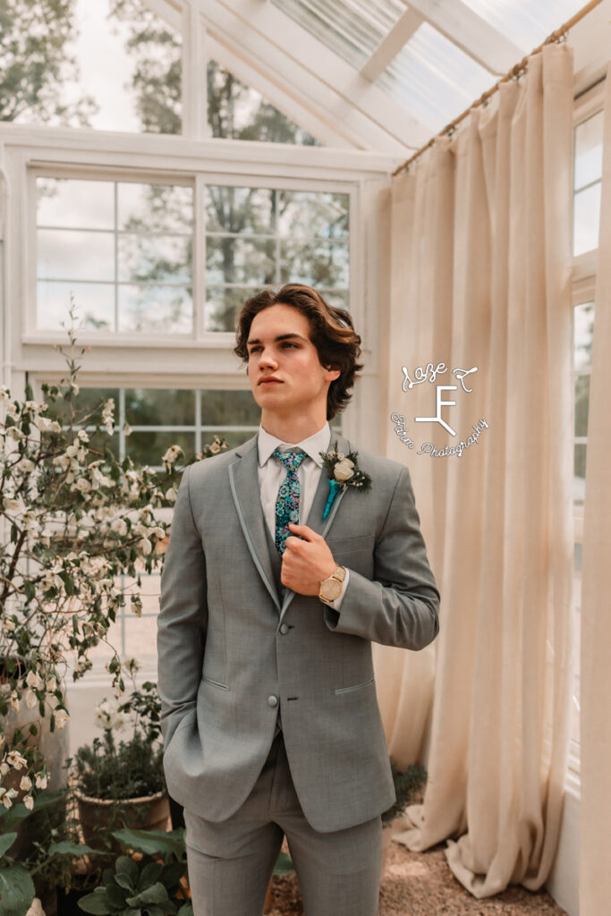 Tanner in grey tux looking right
