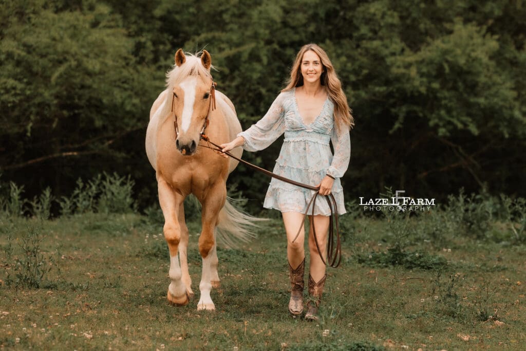 girl and her horse walking towards the camera