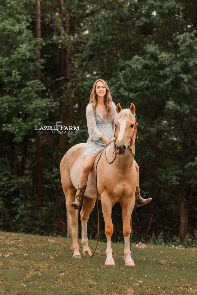 girl sitting on her horse