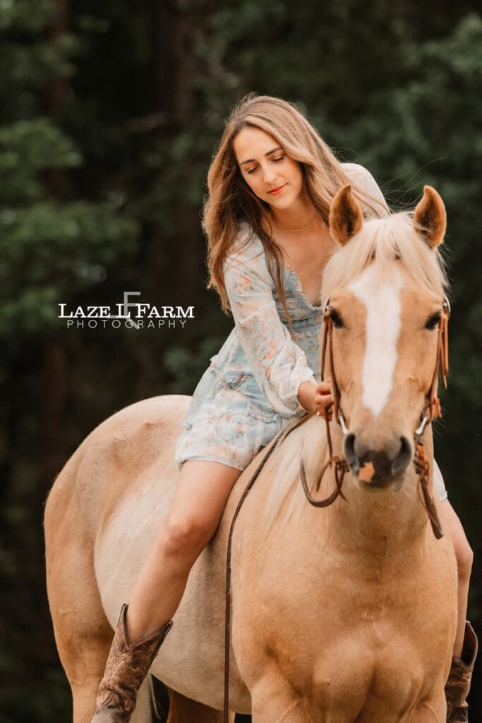 girl looking at her horse