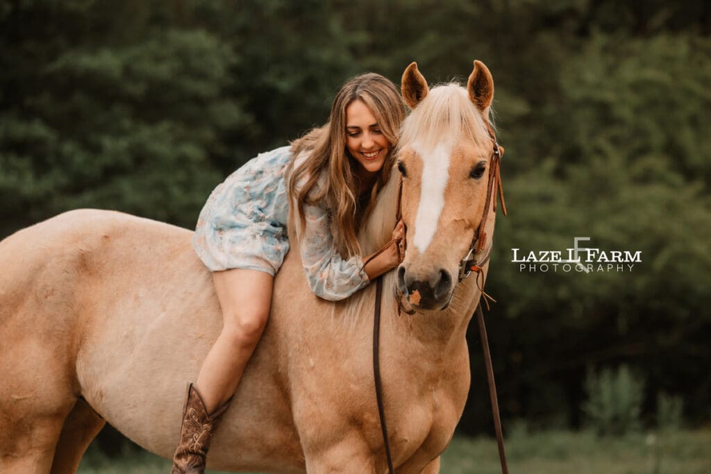 girl giving her horse a hug