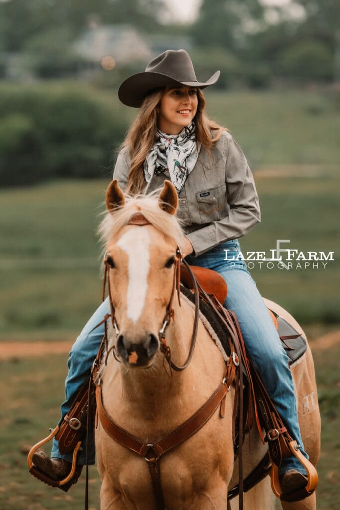 cowgirl riding her horse