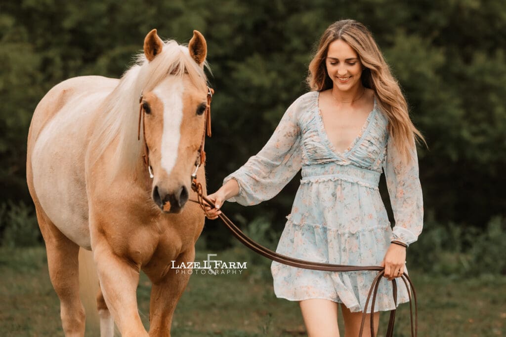 girl and horse walking towards the camera