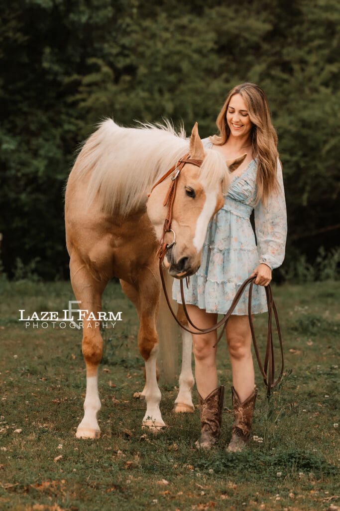 girl scratching horse
