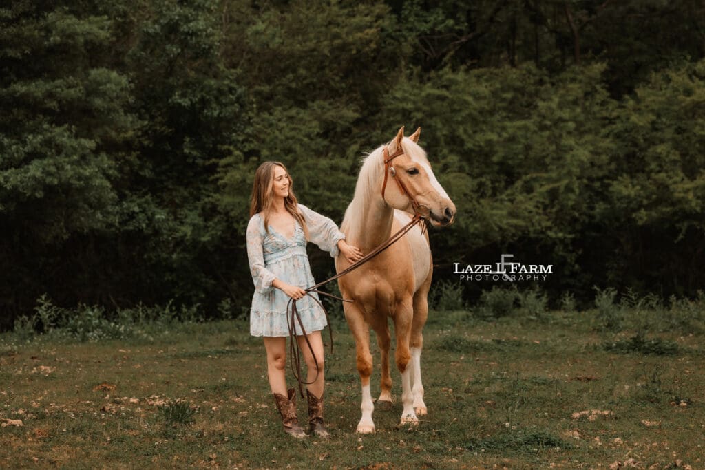girl looking at her horse