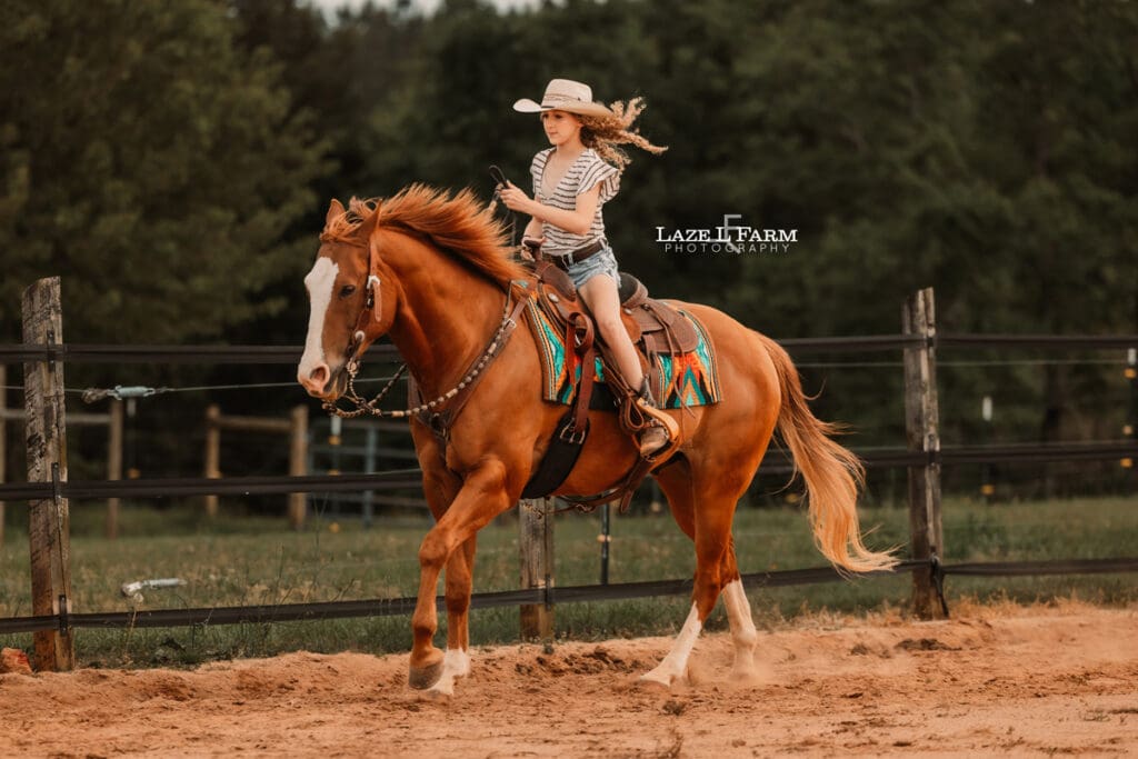 cowgirl loping on her horse