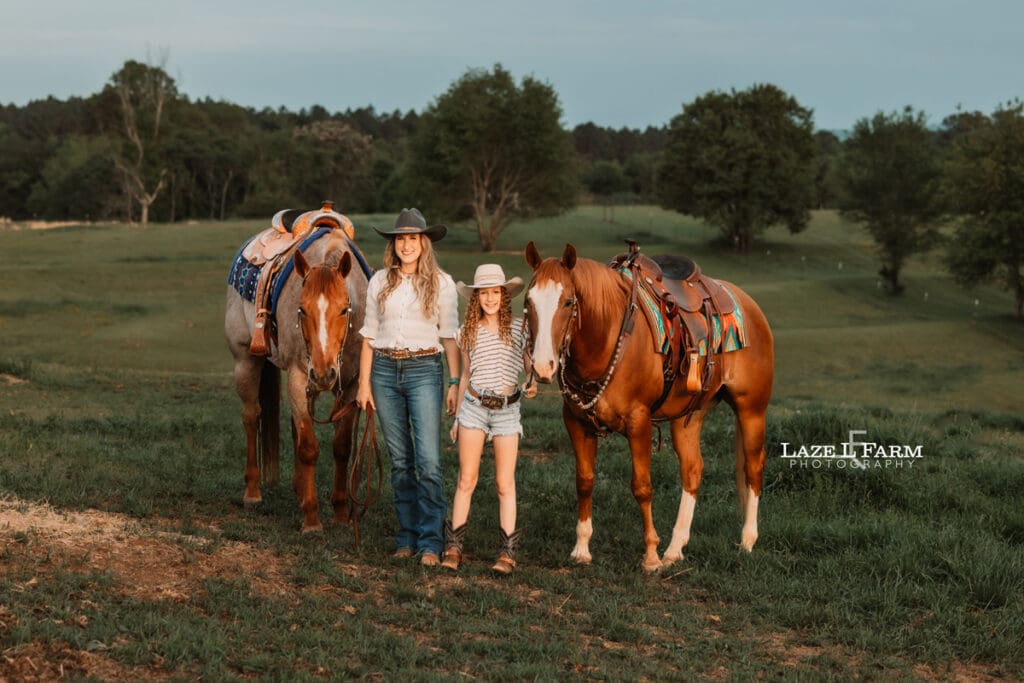 mom and daughter cowgirls sitting on their horses