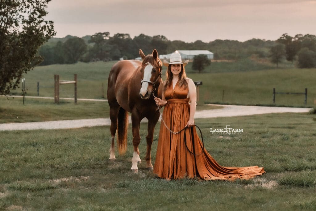 cowgirl with her horse at sunset