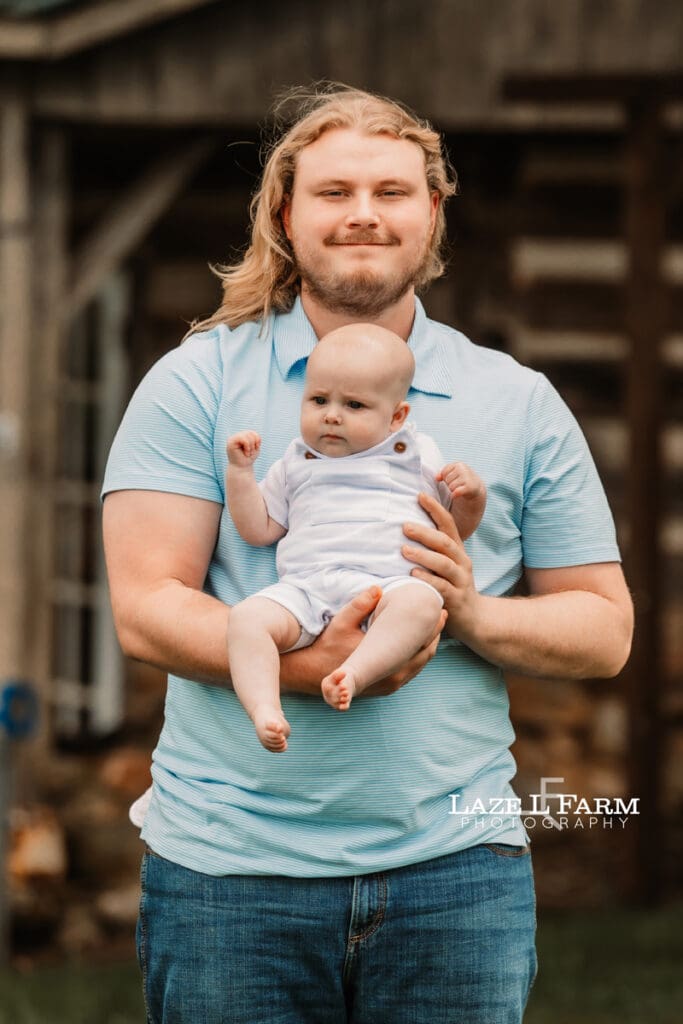 dad and son looking at the camera for family pictures