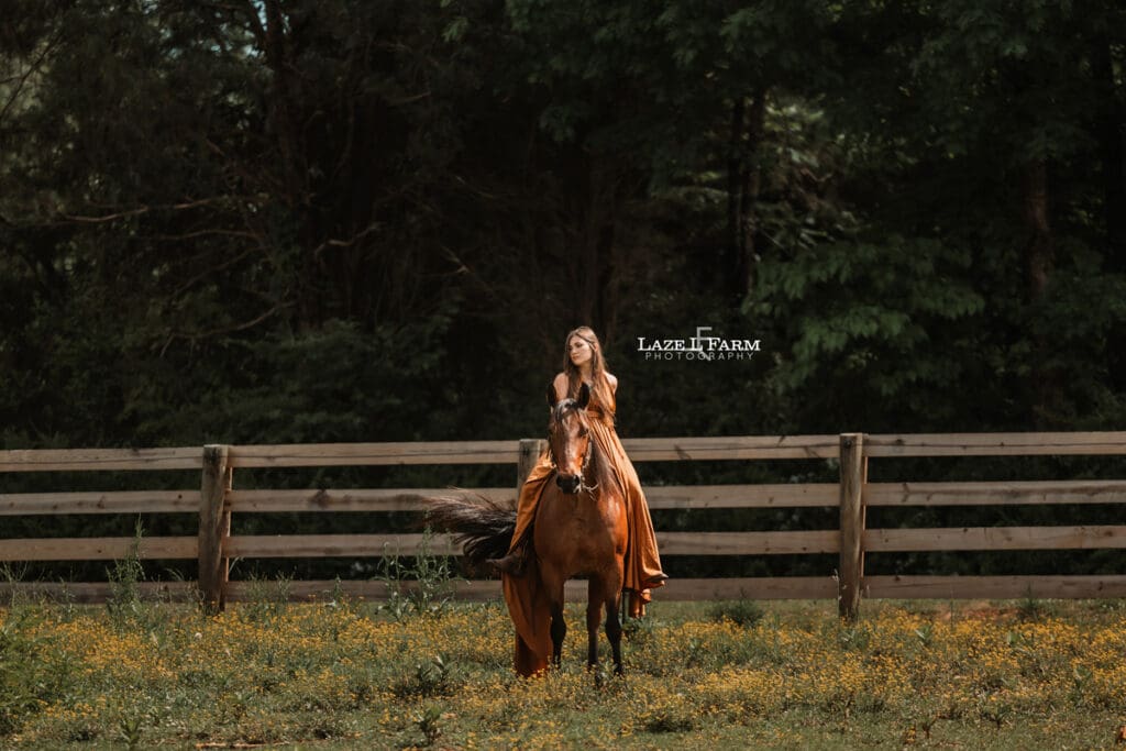 cowgirl riding her horse in a parachute dress