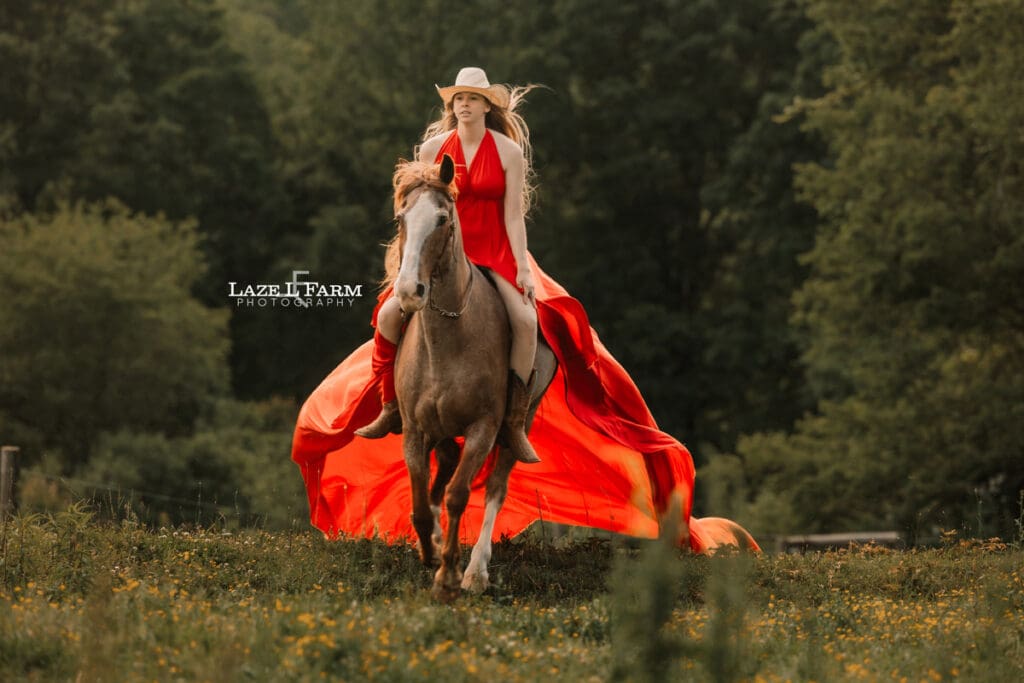 cowgirl riding her horse in a parachute dress