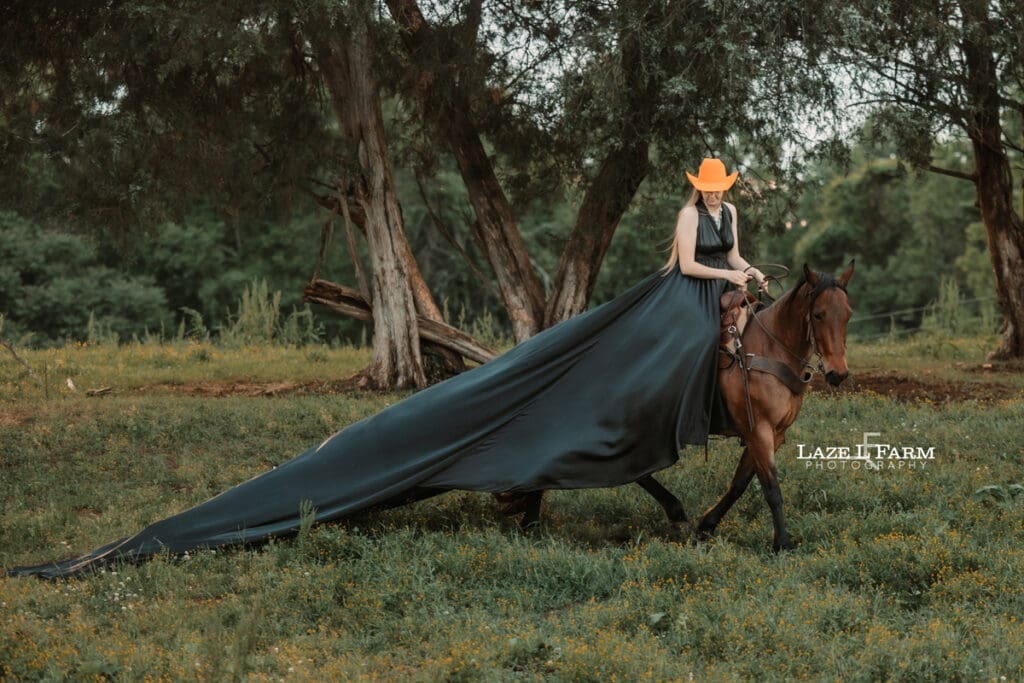 cowgirl riding her horse in a parachute dress