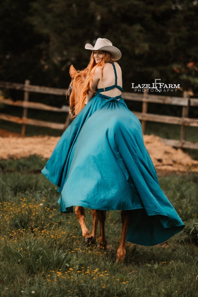cowgirl riding her horse in a parachute dress