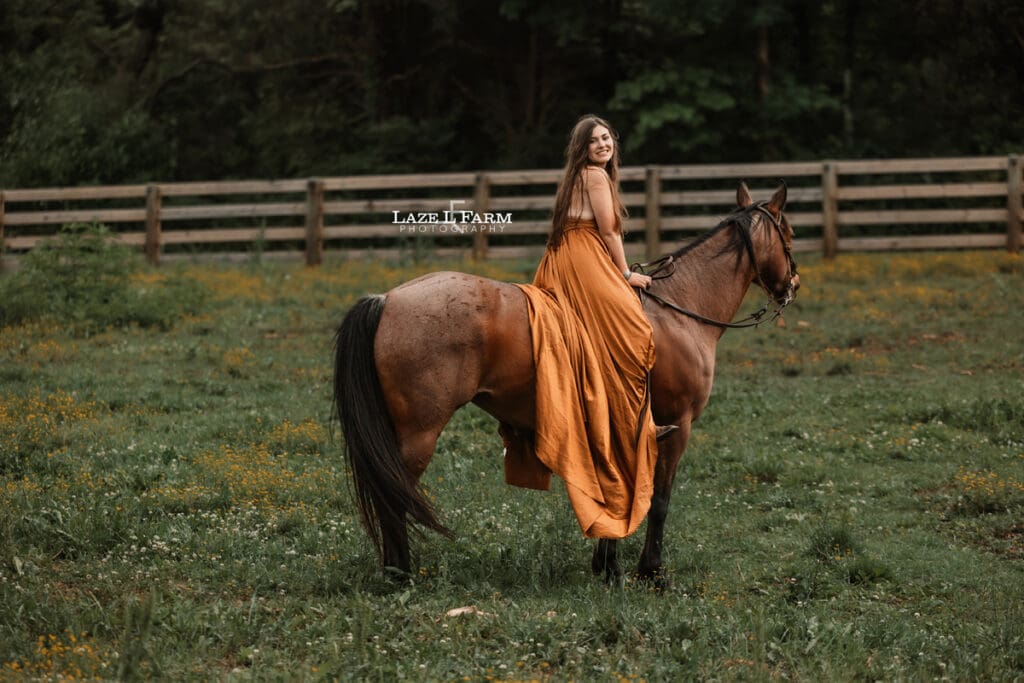 cowgirl riding her horse in a parachute dress
