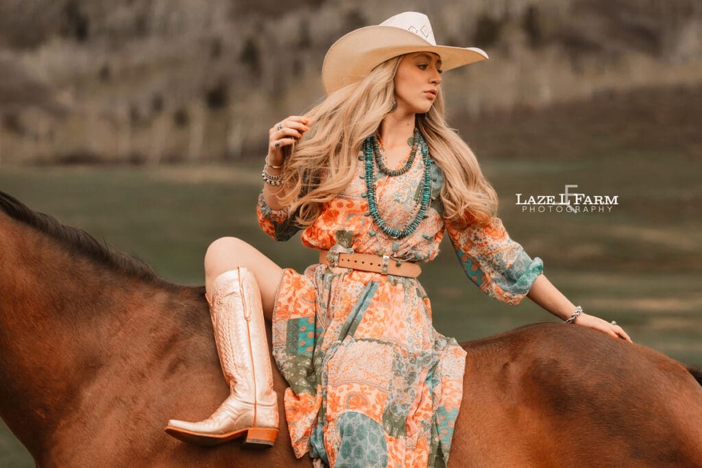 cowgirl sitting on her horse sideways
