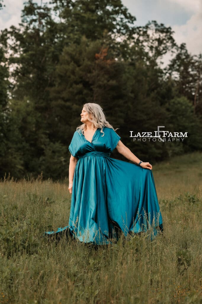 lady in big flowy dress in the middle of a field for a photoshoot