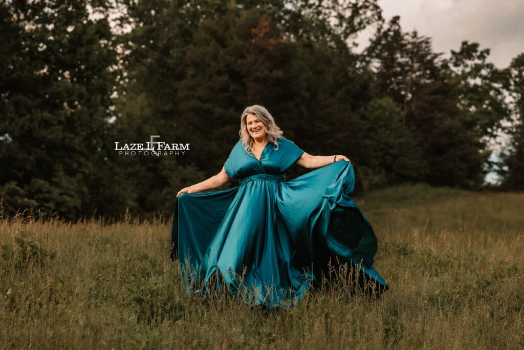 lady in big flowy dress in the middle of a field for a photoshoot