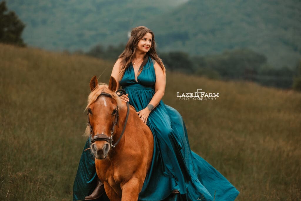 cowgirl riding her horse in a beautiful green dress