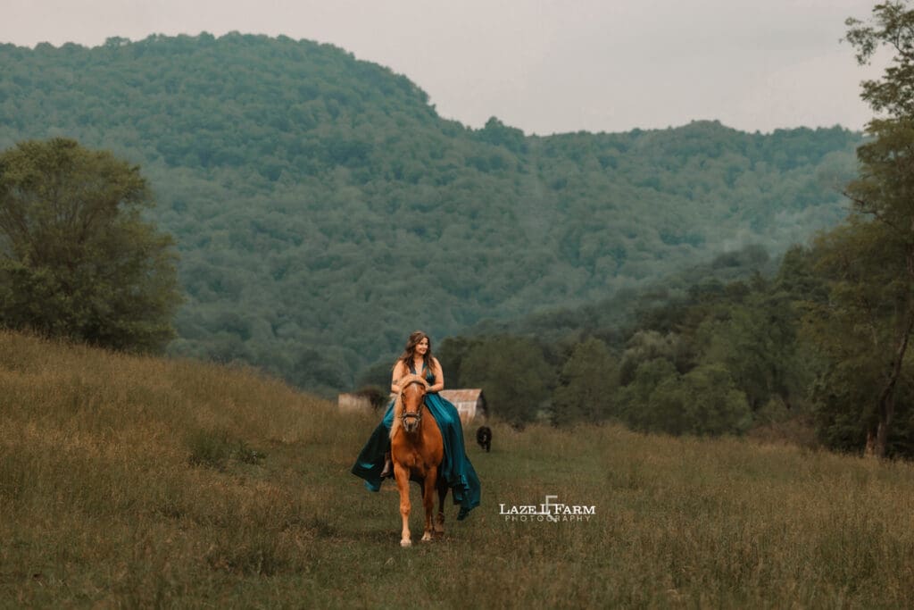 cowgirl riding her horse in a beautiful green dress
