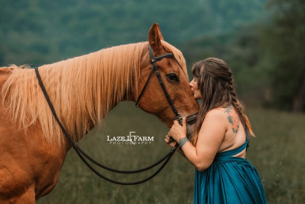 girl kissing her horse on the nose