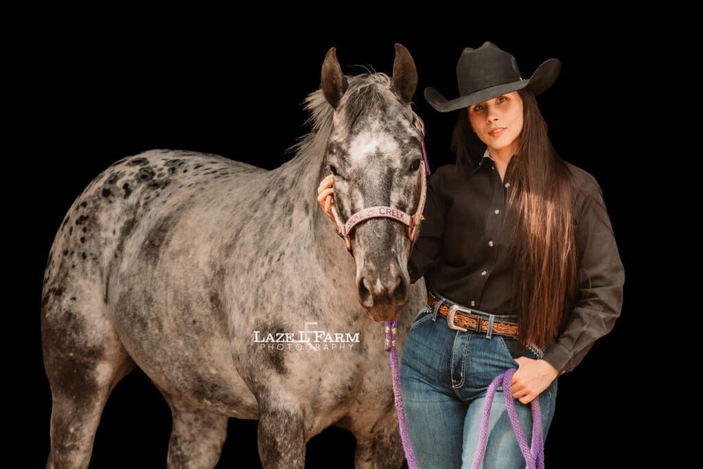 cowgirl and her appaloosa horse
