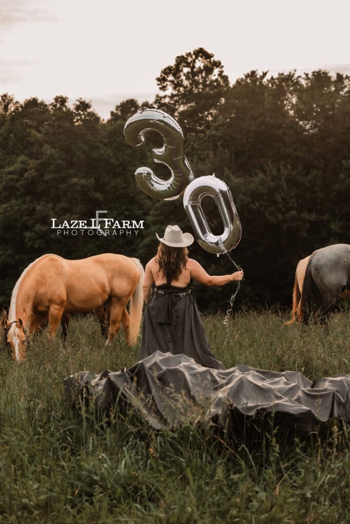 a cowgirl celebrating her 30th birthday with balloons