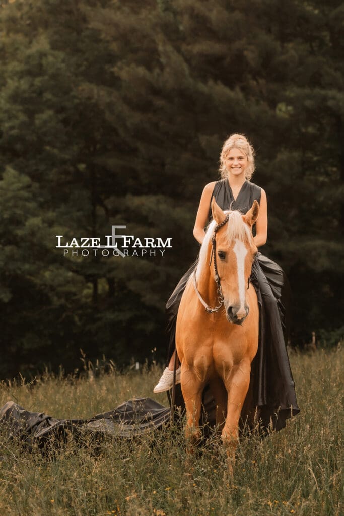 cowgirl with a parachute dress on riding her horse