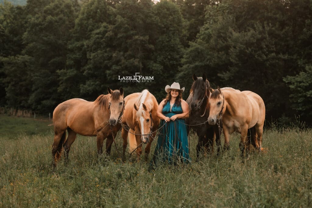 cowgirl in a turquoise parachute dress with her horse