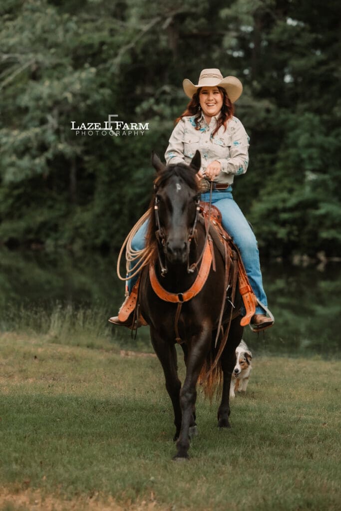 cowgirl riding her horse