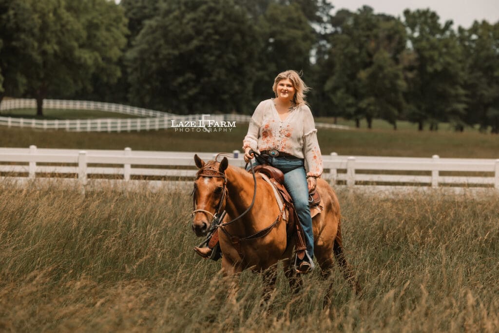 cowgirl with her horse in a field