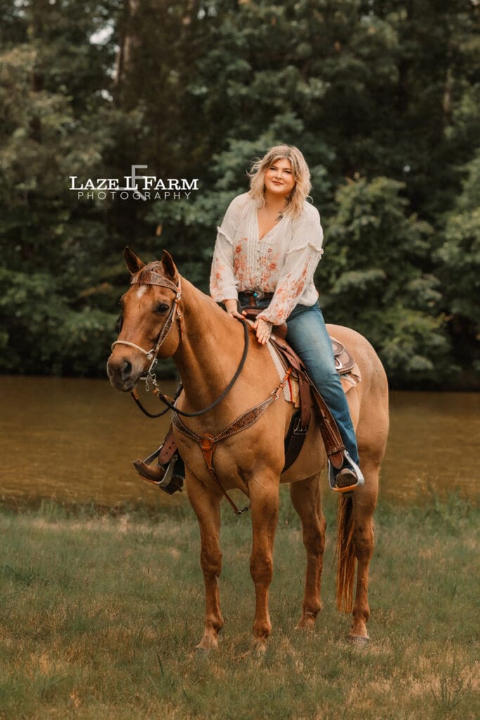 cowgirl petting her horse