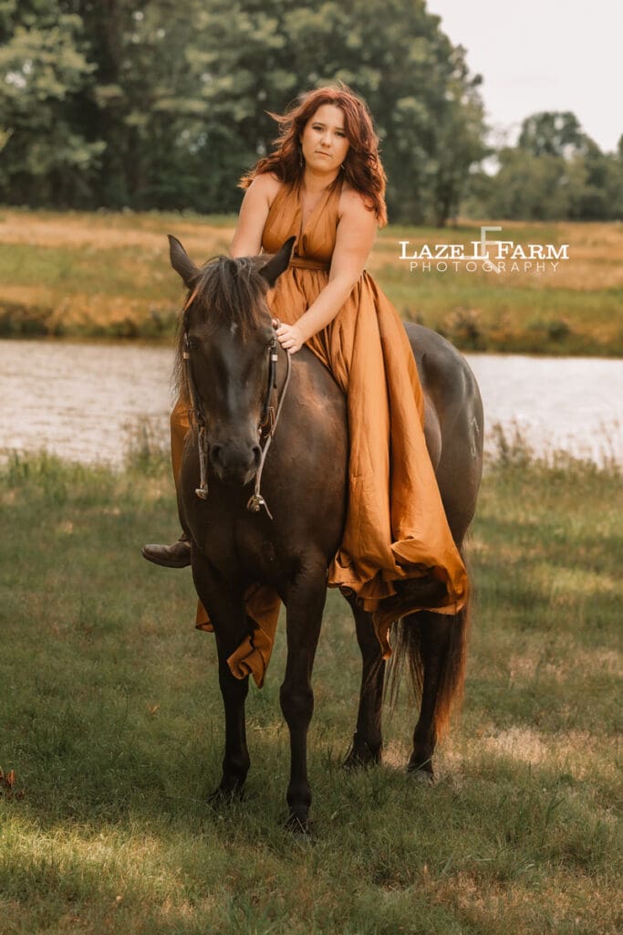 cowgirl riding her horse