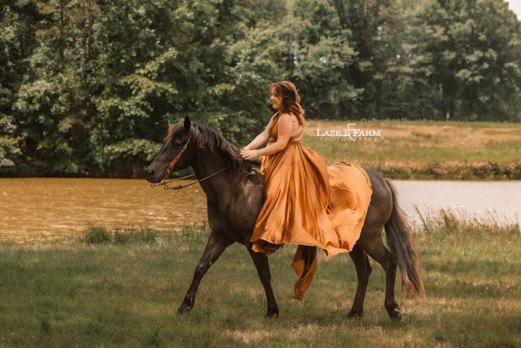 cowgirl riding her horse in a parachute dress