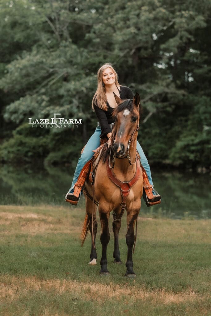 cowgirl riding her horse