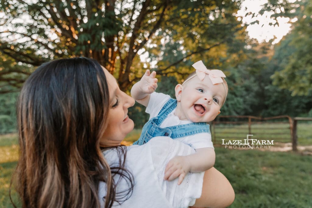 little girl waving a the camera
