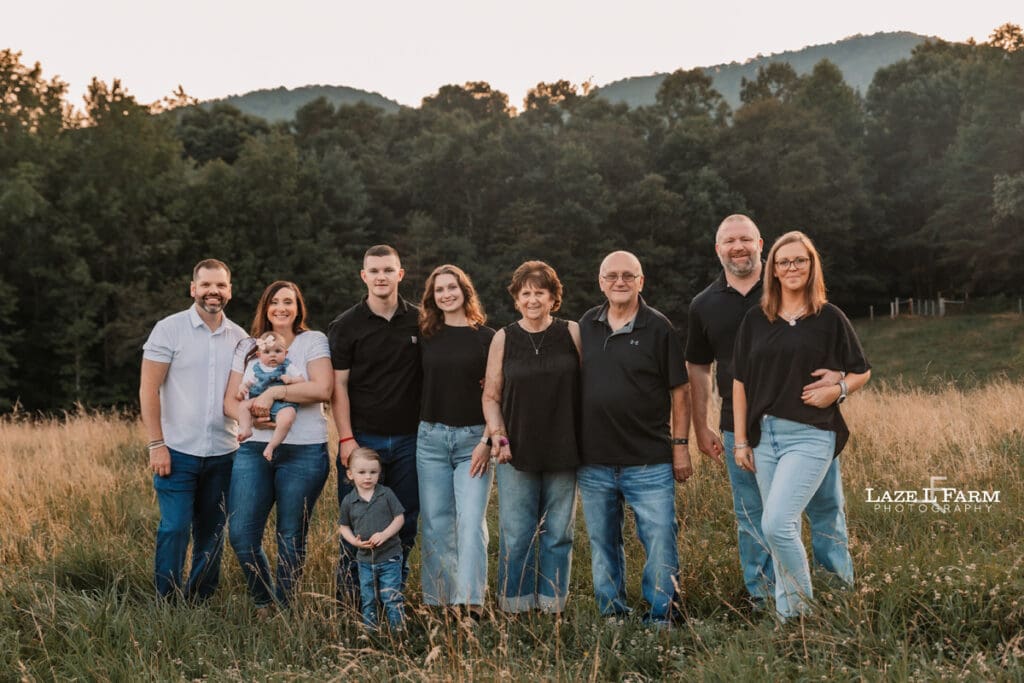 family out in a field at sunset