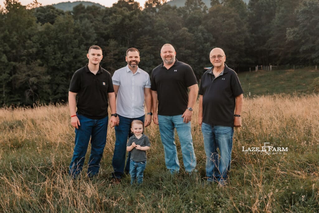 family out in a field at sunset
