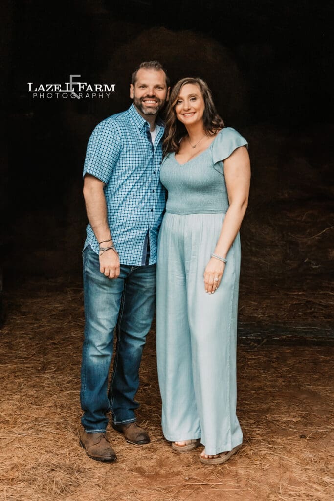 couple family picture in a barn