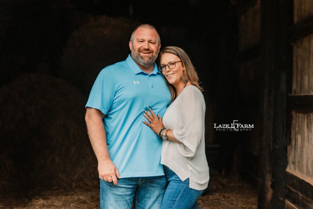couple family picture in a barn