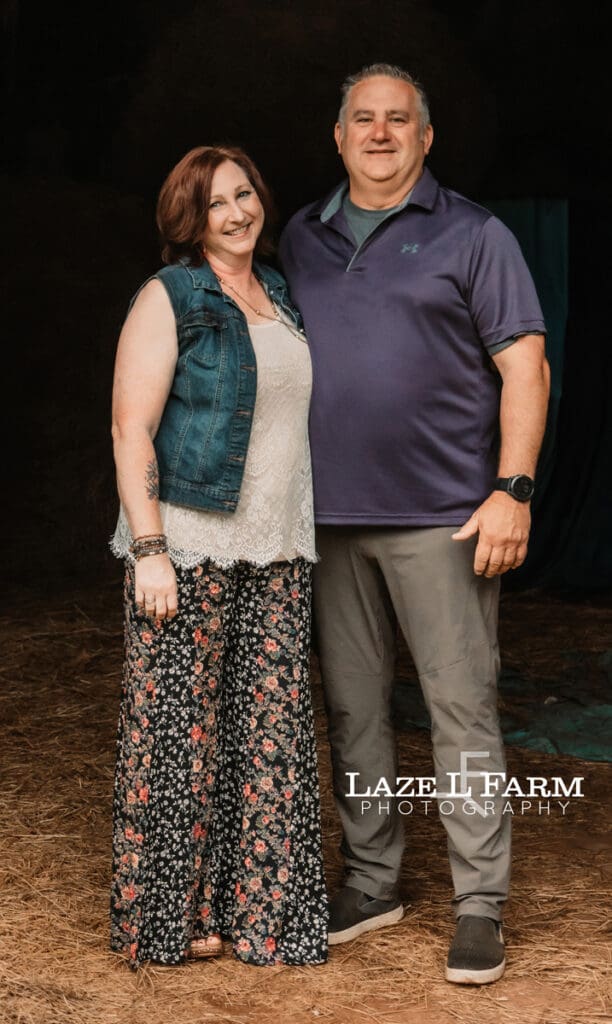 couple family picture in a barn