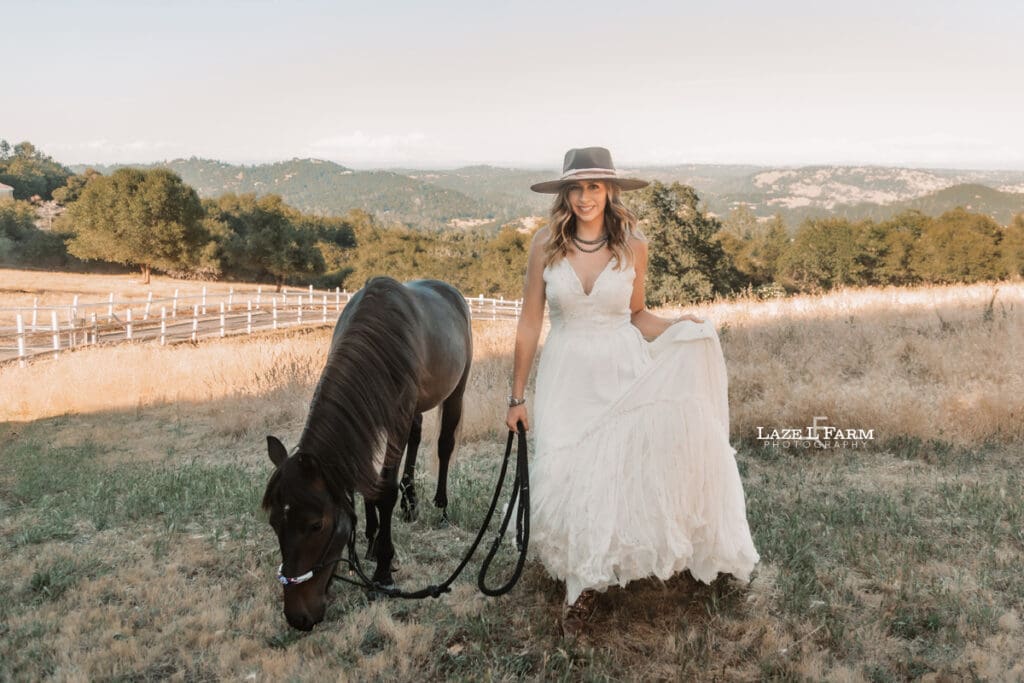 cowgirl with her horse walking towards the camera