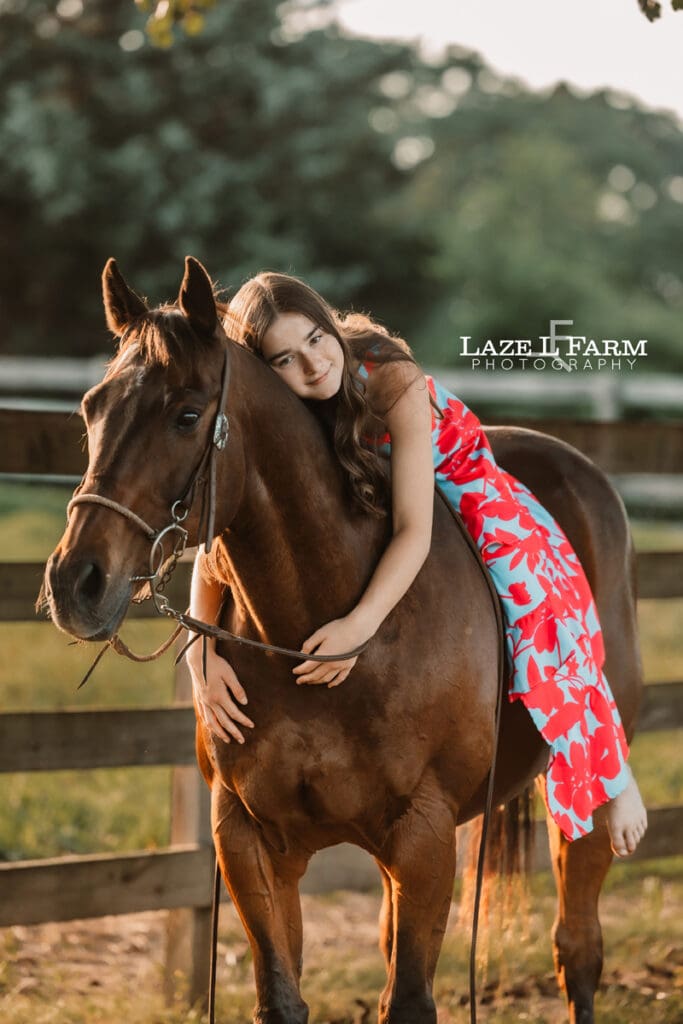 girl giving her horse a hug