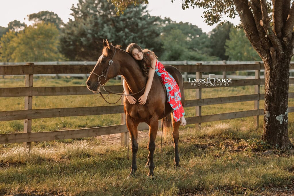 girl giving her horse a hug