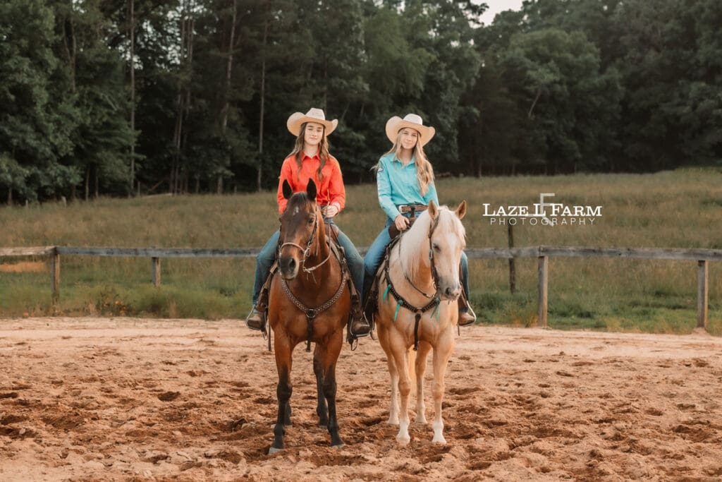 best friend cowgirls standing beside of each other in the arena