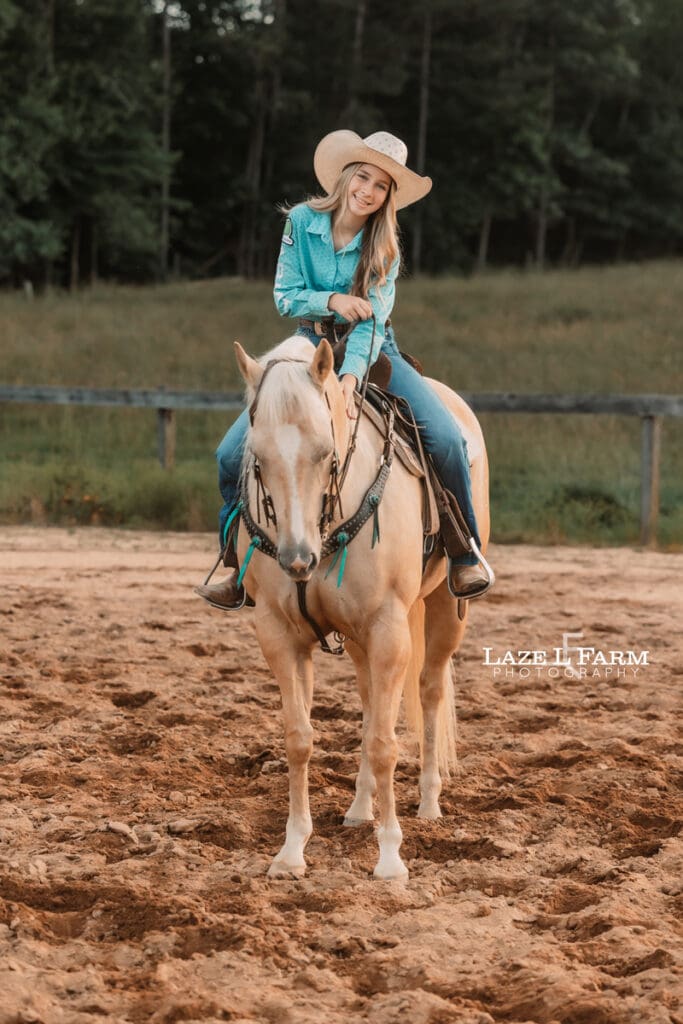 cowgirl petting her horse