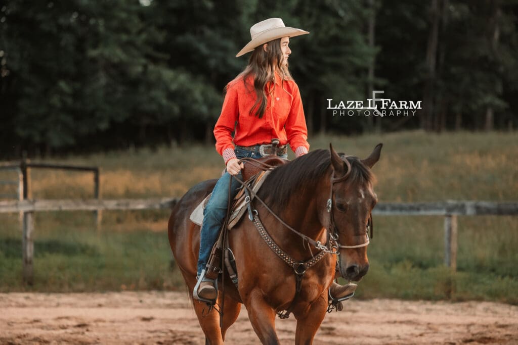 cowgirl riding her horse